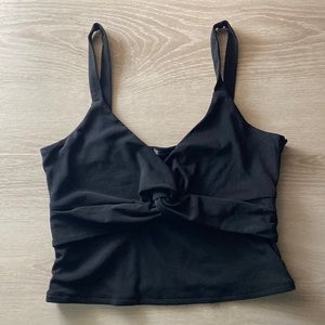 Medium, black, dynamite going out top! With a knot in the middle